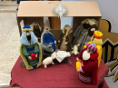 The younger children had a knitted crib at the Crib Service